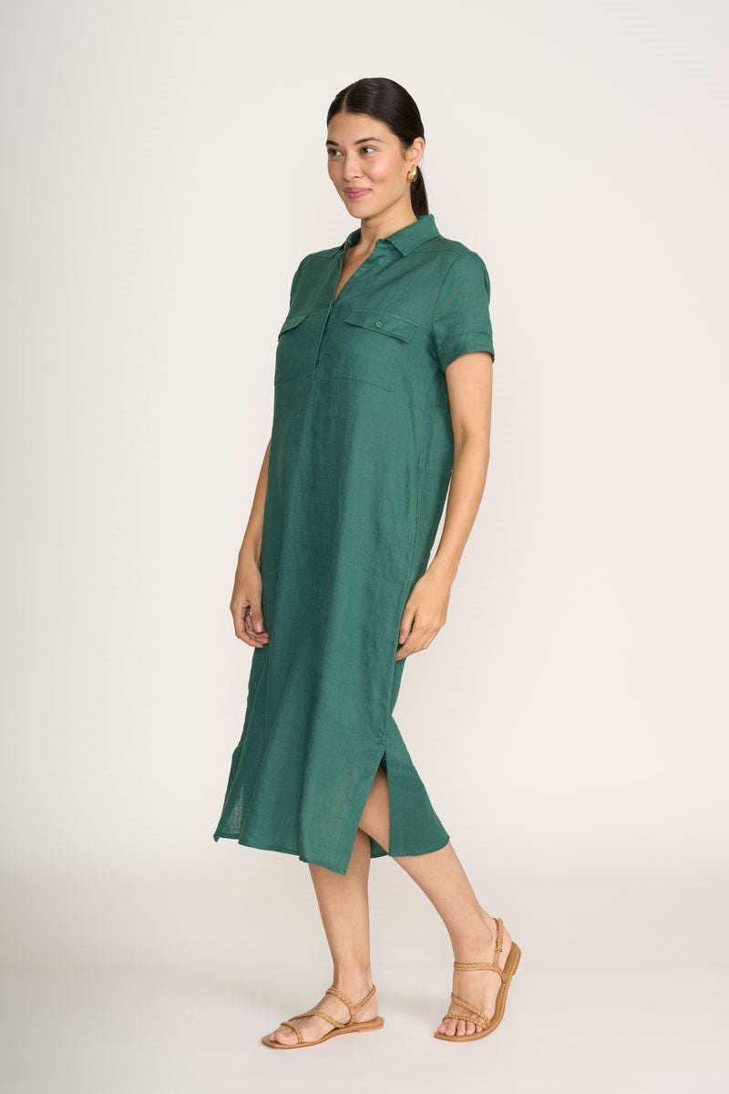 Woman wearing a green dress on a white background