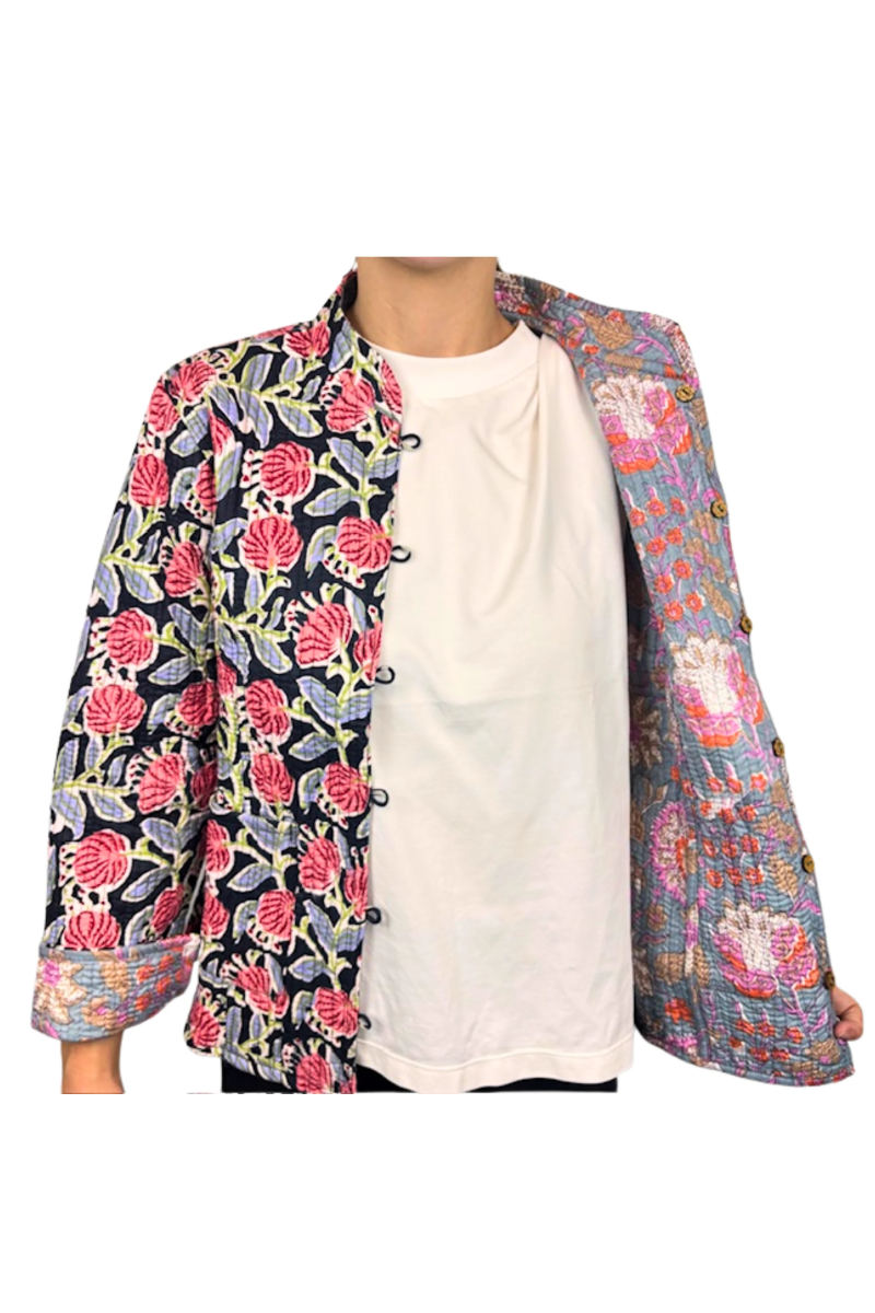 Multicolored floral jacket over a white shirt on a white background