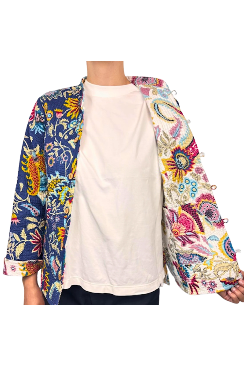 Navy blue floral patterned shirt with colorful designs on a white background