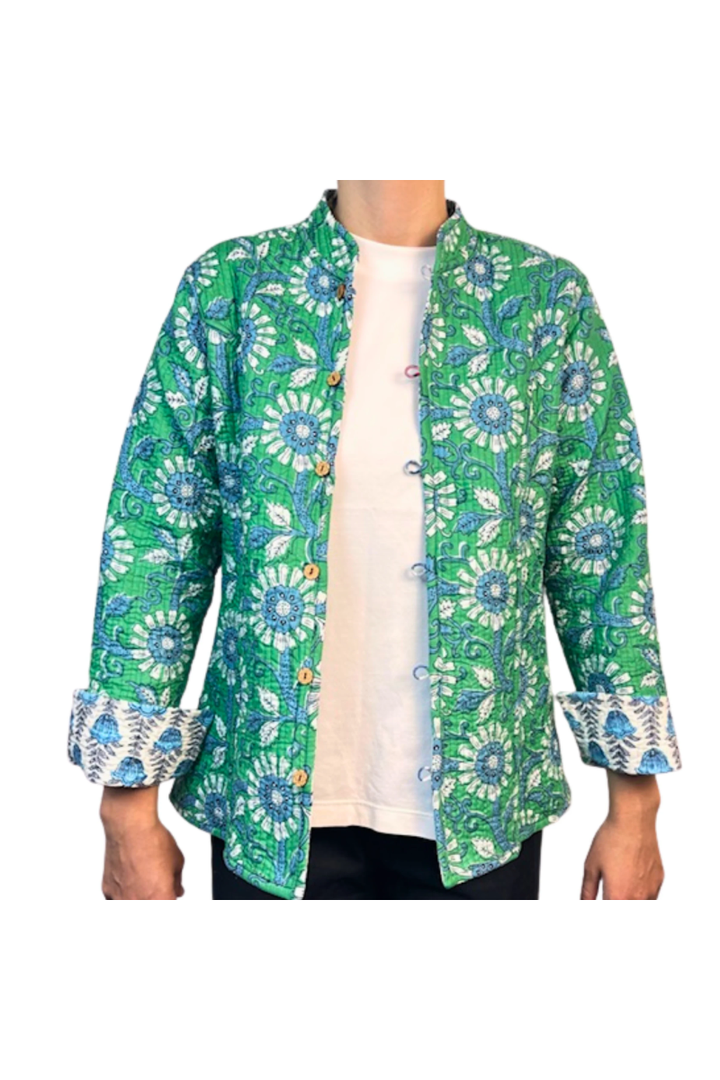 Green floral patterned jacket worn by a person on a white background