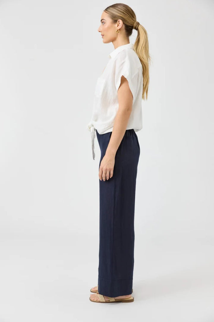  Side view of Studio Tie Shirt in salt color, showcasing the relaxed fit and tied front detail, from Ivy Vibe Boutique.