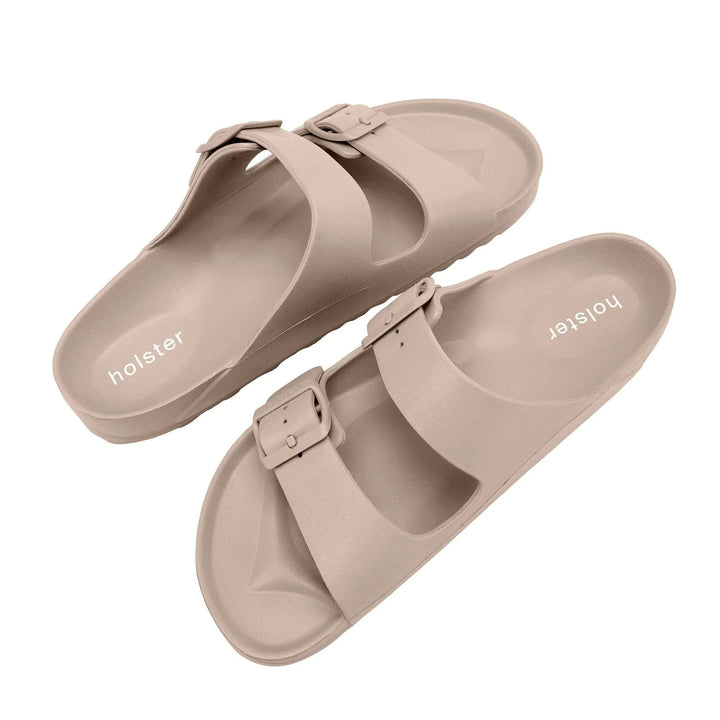 Close-up top-down view of the Sundreamer Slide in beige, focusing on the textured strap detail and cushioned insole for added comfort.