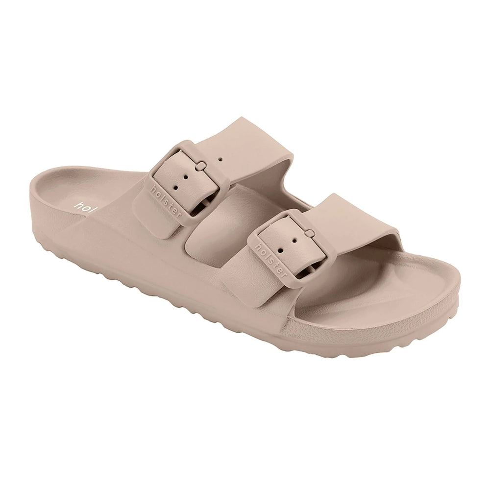 Side view of the Sundreamer Slide in beige, showcasing the sleek profile, flat sole, and wide strap for a minimalist, modern look.