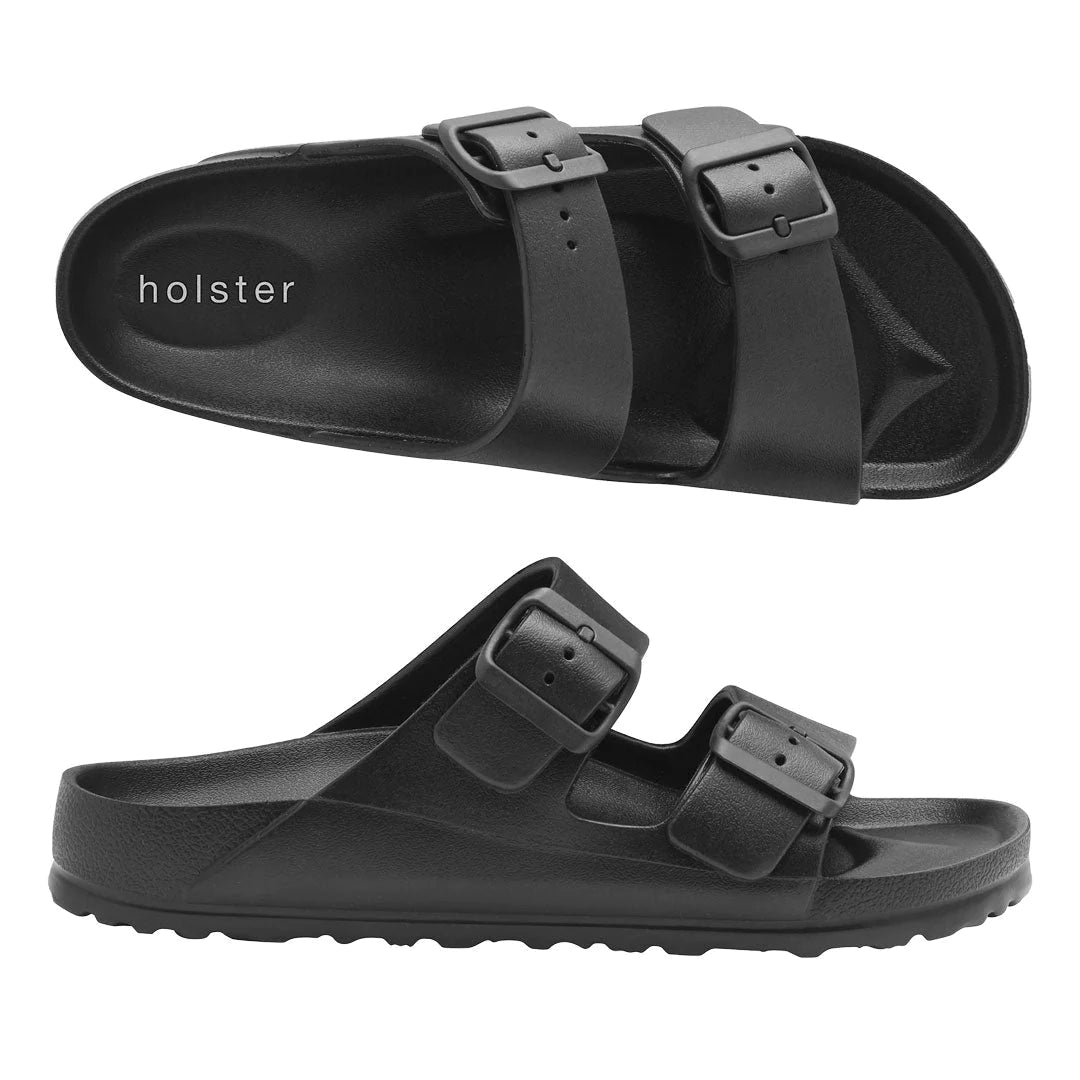 Front view of the Sundreamer Slide in black, featuring a wide strap and flat sole with a sleek, minimalist design.
