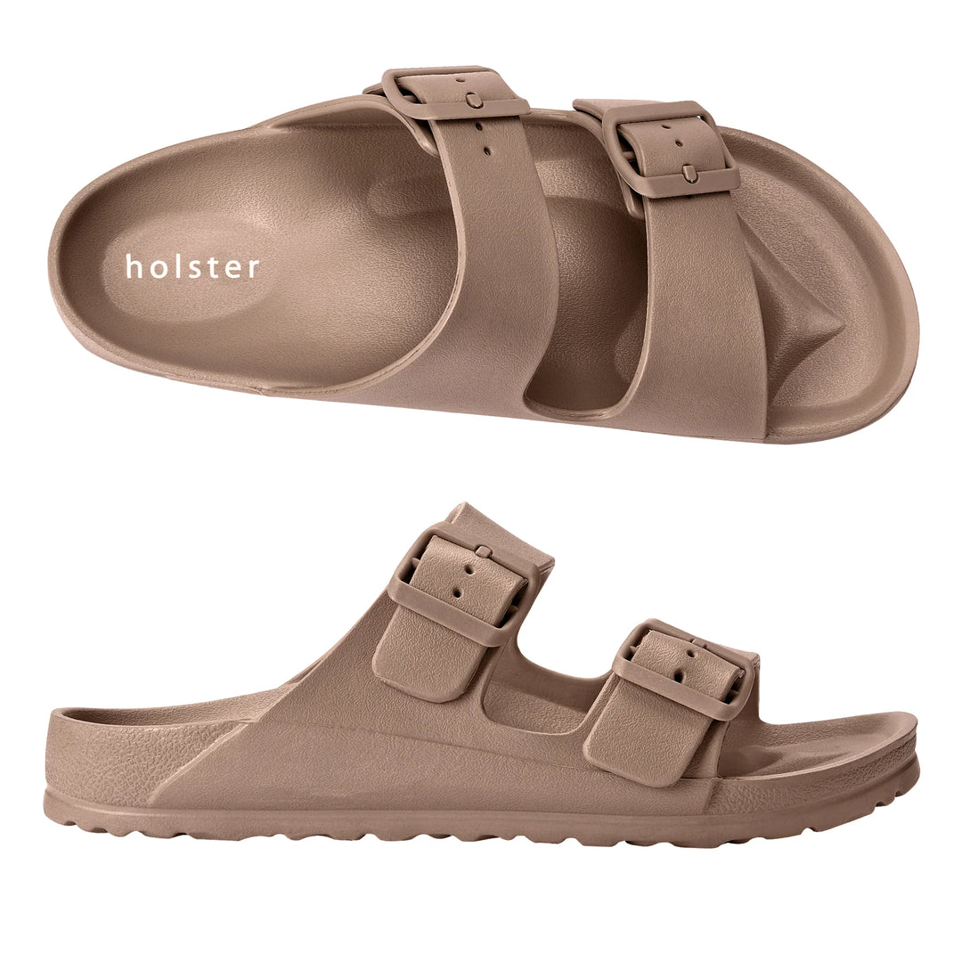 Front view of the Sundreamer Slide in natural color, featuring a wide strap and flat sole with a clean, minimalist design.
