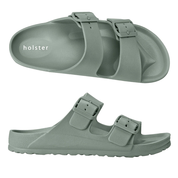 Front view of the Sundreamer Slide in seagrass green, featuring a wide strap and flat sole with a clean, minimalist design.