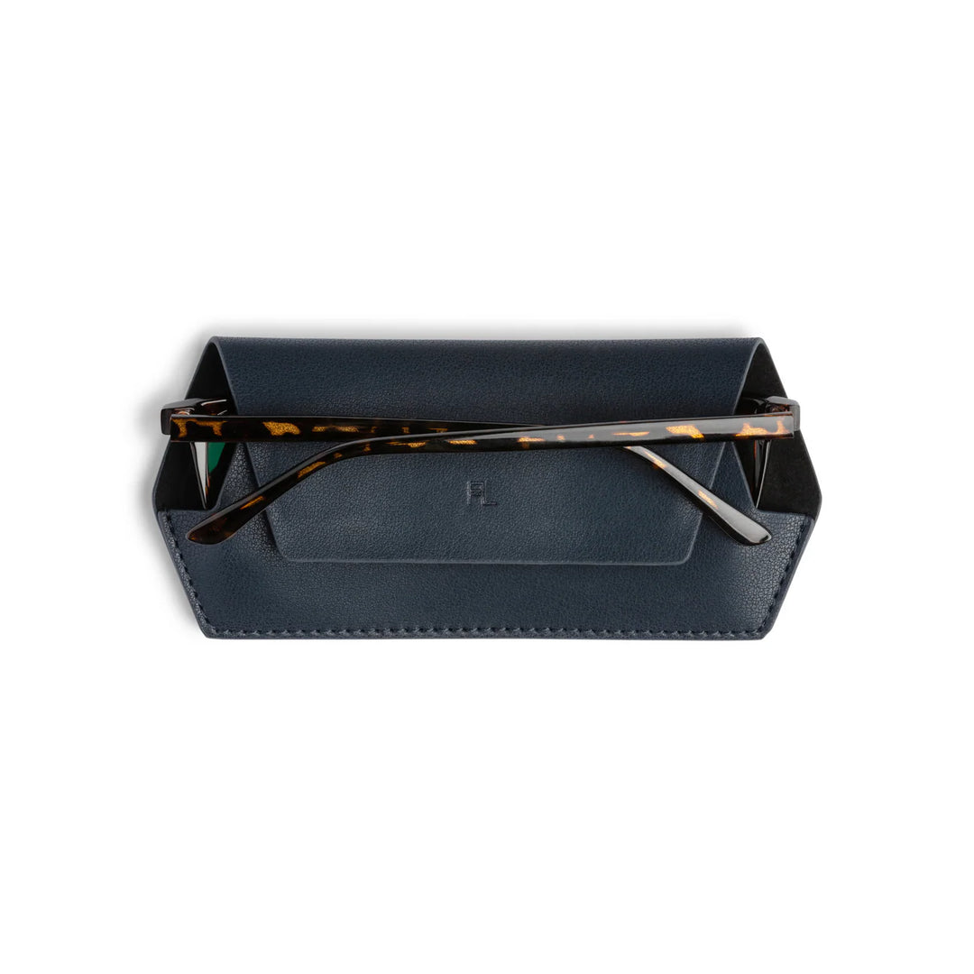 Black eyeglass case with tortoiseshell frame on a white background