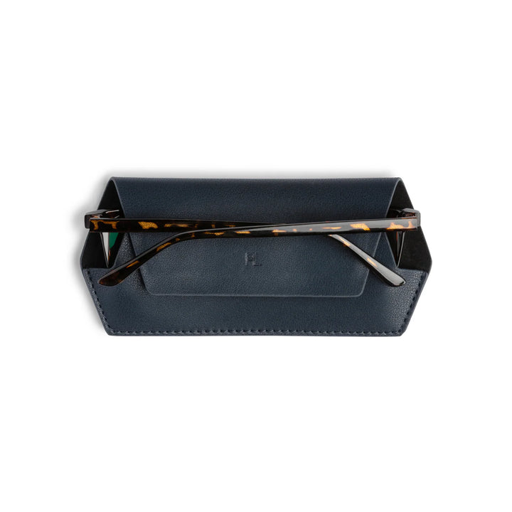 Black eyeglass case with tortoiseshell frame on a white background