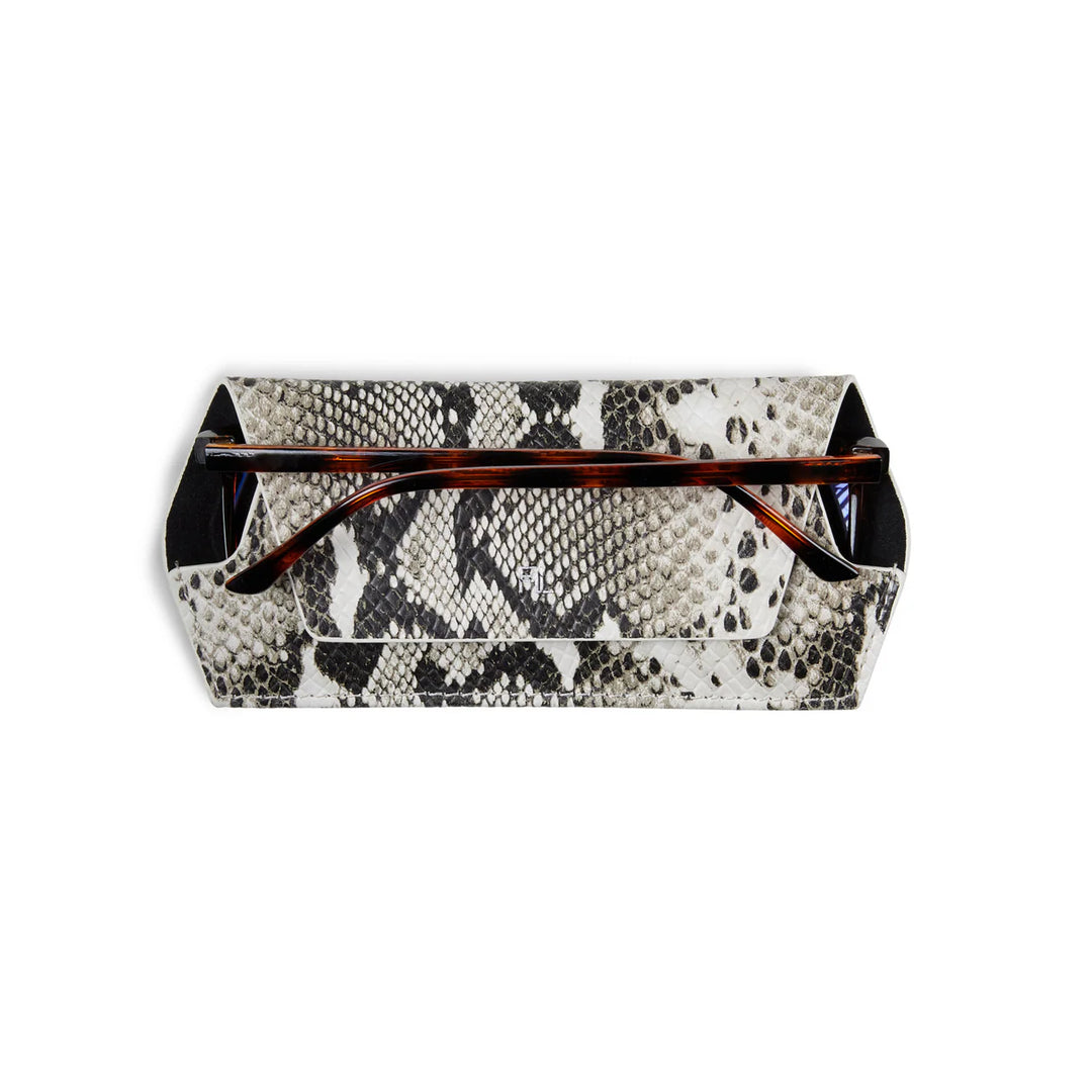 Snakeskin patterned clutch bag with tortoiseshell accents on a white background
