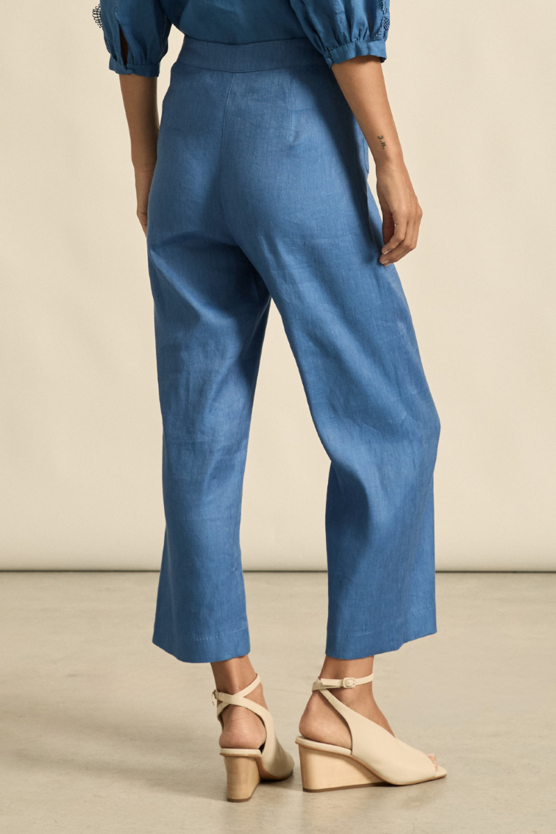 This back view of the Syllabus Pant in Shoreline highlights its clean, tailored finish, subtle seam detailing, and cropped length for a polished, modern look.
