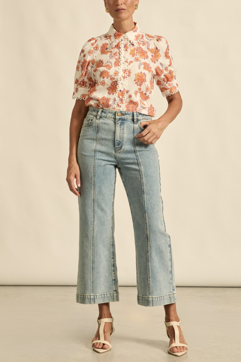 Front view of the Tenure Jean in washed denim, featuring a straight-leg silhouette, classic five-pocket design, and high-rise waist.