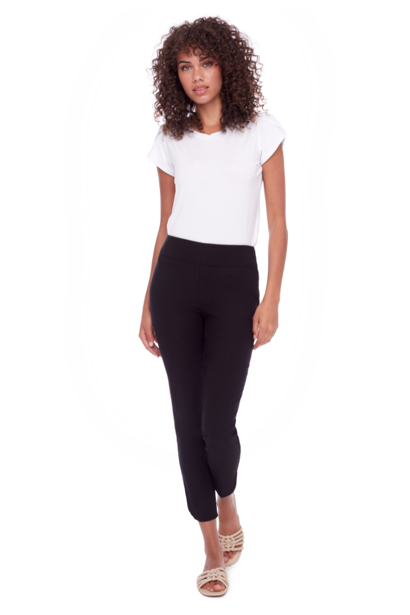 Woman wearing a white t-shirt and black leggings on a white background