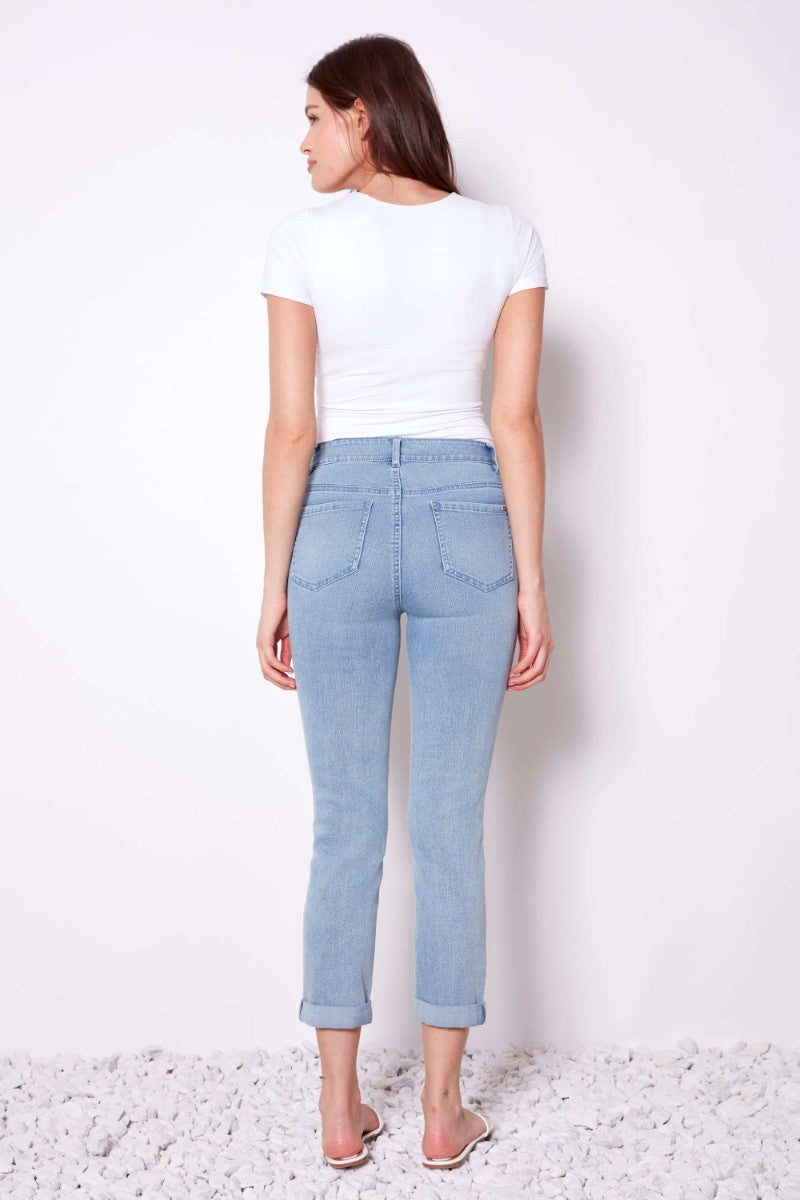 Back view of the Updated Cropped Denim Pant in light blue from Ivy Vibe Boutique, showcasing the cropped fit and clean denim design.
