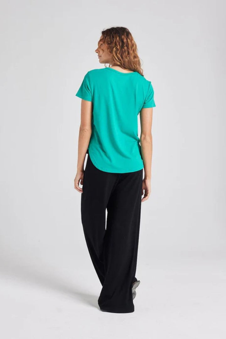 Back view of the Veronica Tee in emerald green, displayed at Ivy Vibe, showcasing its soft bamboo fabric and relaxed, easy-to-wear silhouette.