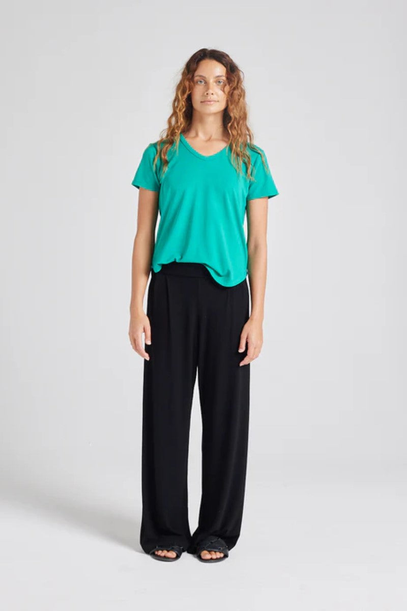 Front view of the Veronica Tee in emerald green, displayed at Ivy Vibe, featuring a soft V-neckline, short sleeves, and a relaxed, breathable fit.