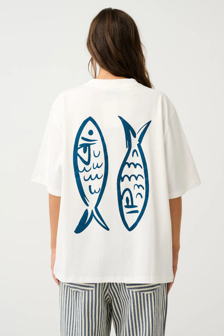 Back view of white oversized T-shirt with blue fish print.